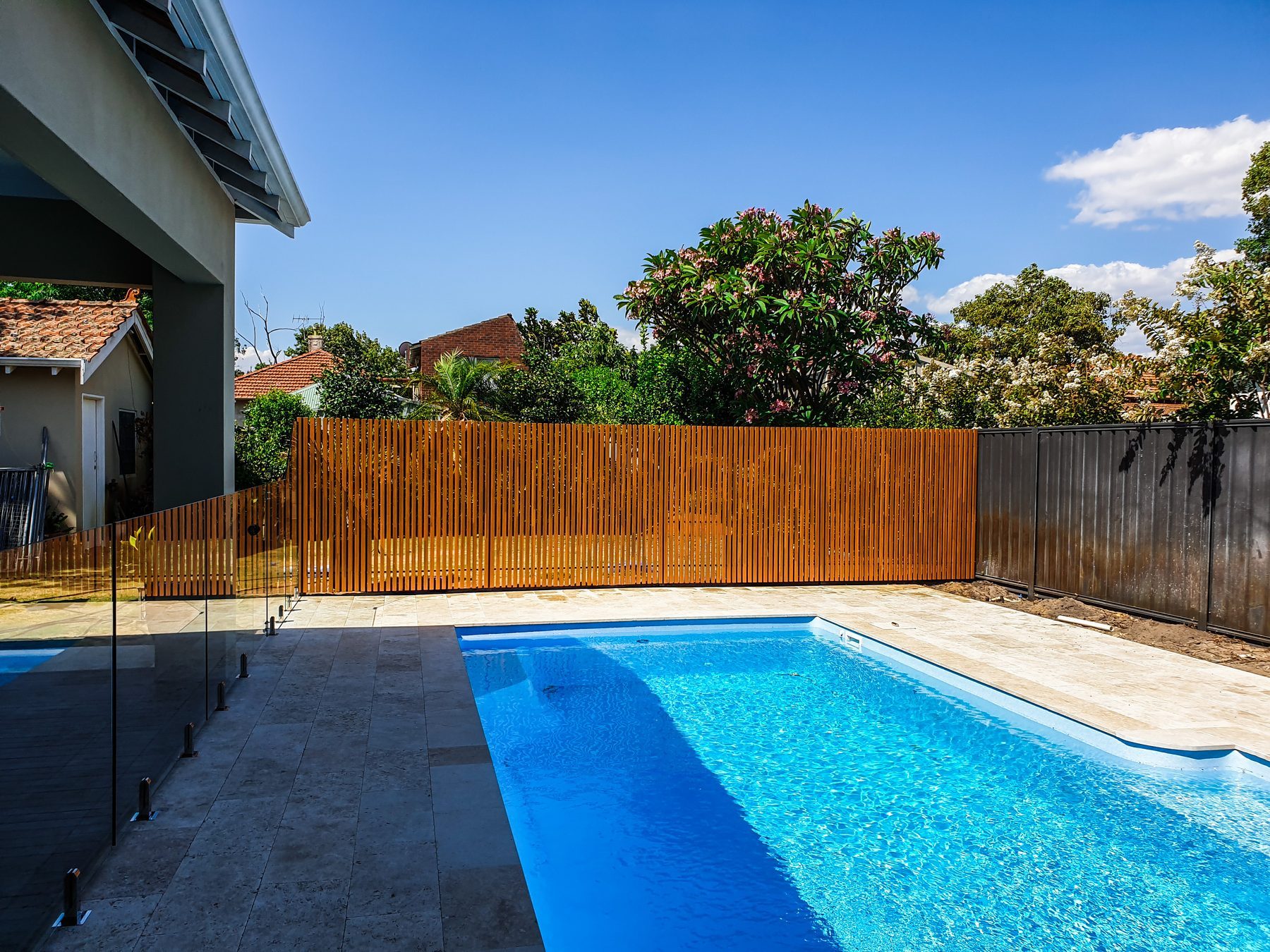 Timber look slat fencing beside a Perth pool