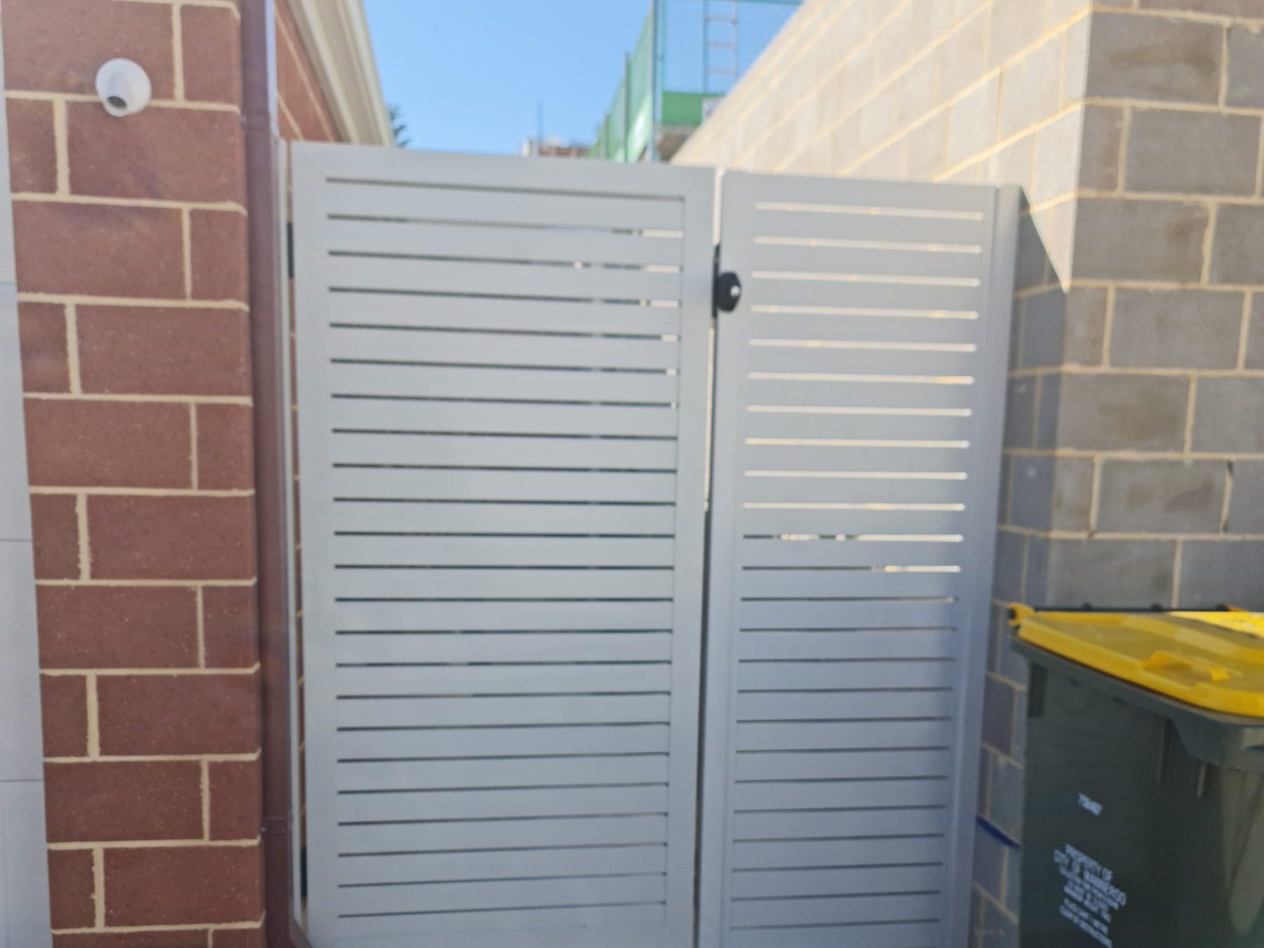 White aluminium slatted double gate in Perth