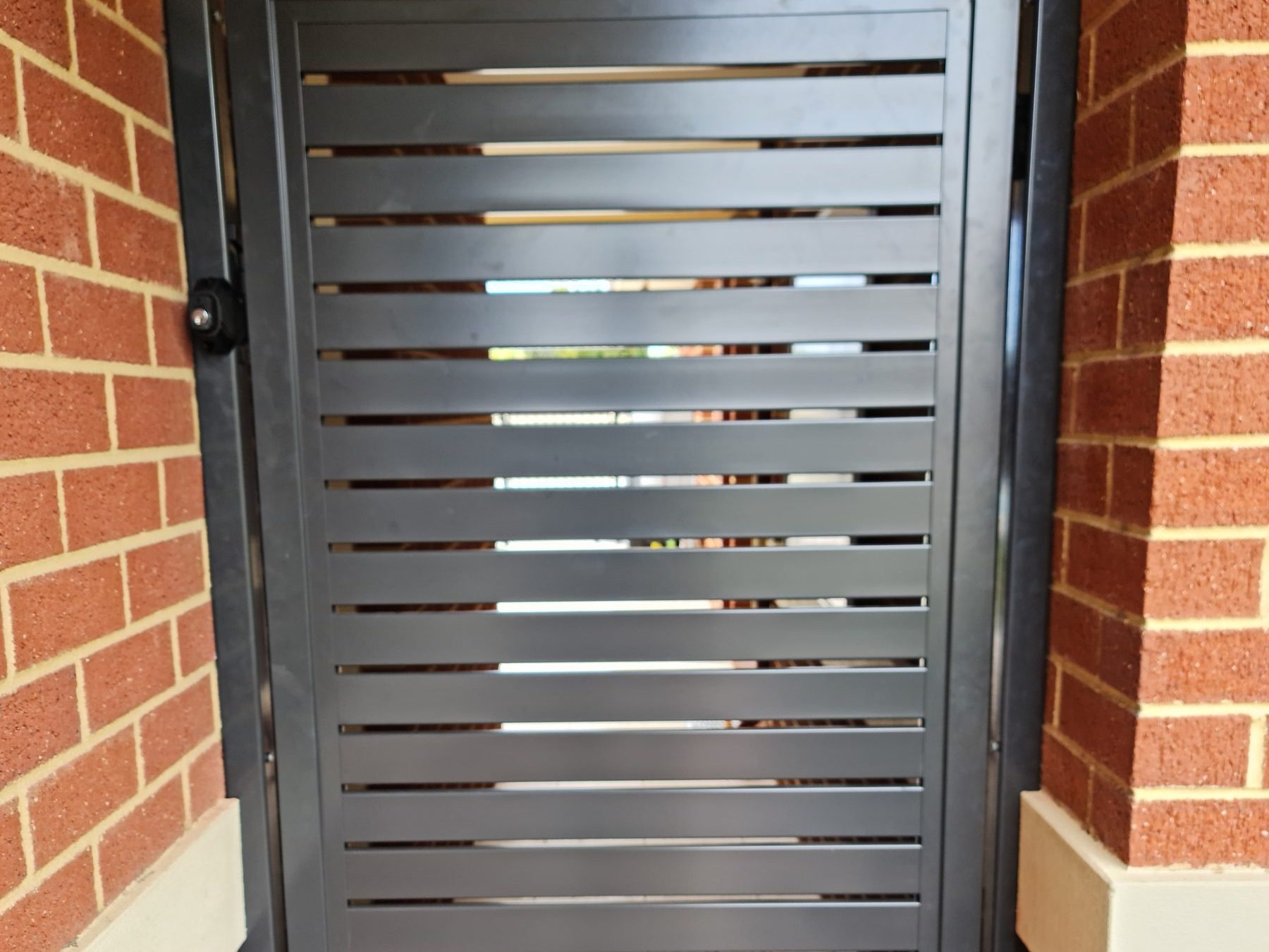 Horizontal aluminium slatted gate in Perth