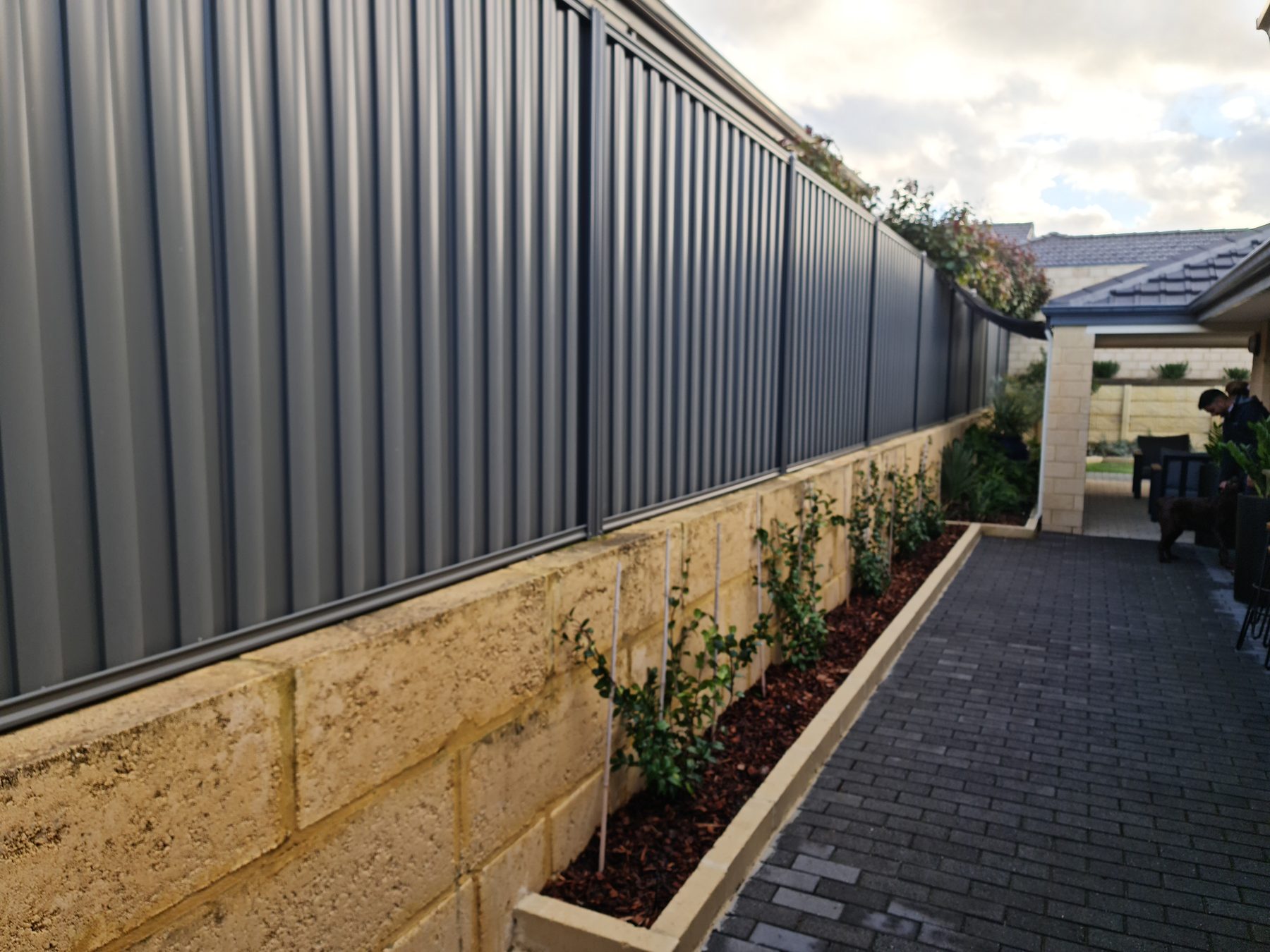 Colorbond fence run along a Perth side boundary