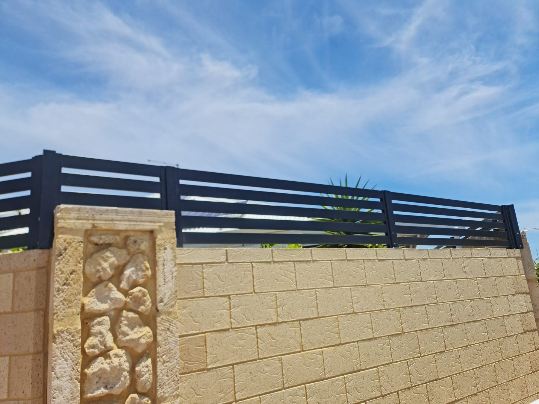 Fencing above a limestone base in Perth
