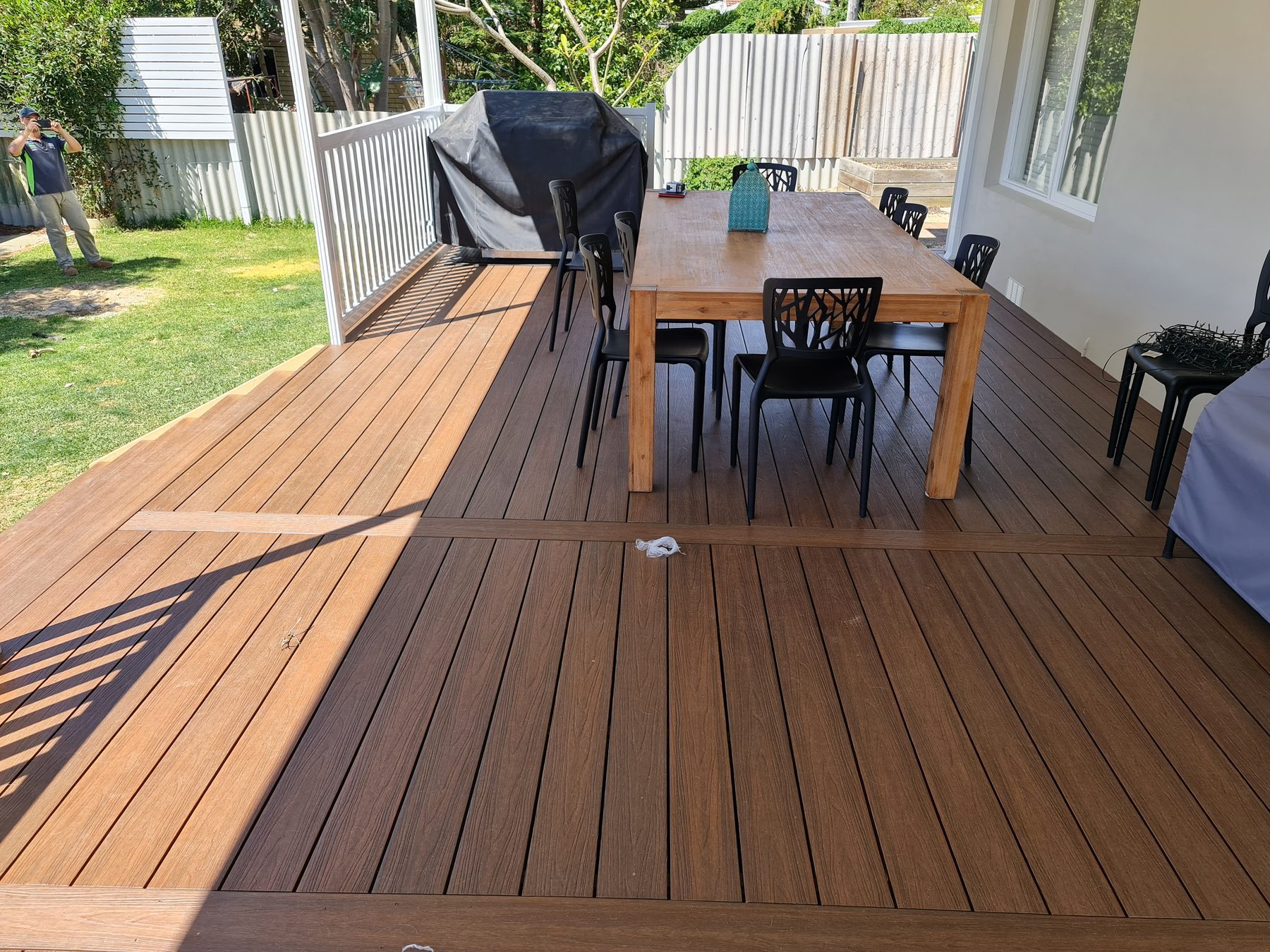 Brown composite decking with outdoor dining in Perth