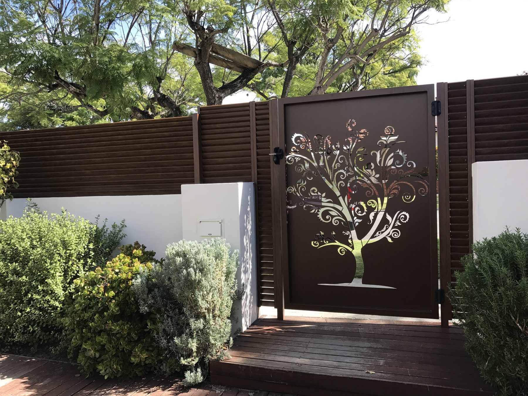Laser cut gate with tree design in Perth