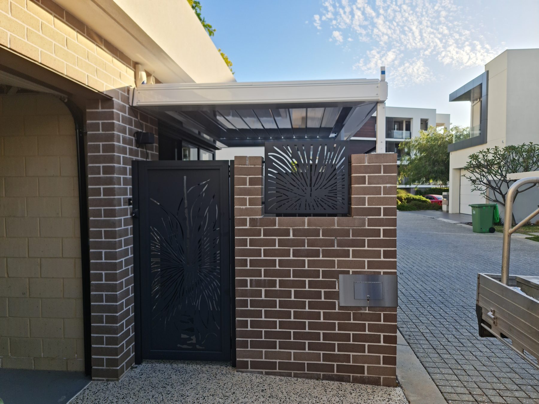 Laser cut decorative panel beside a Perth entry gate