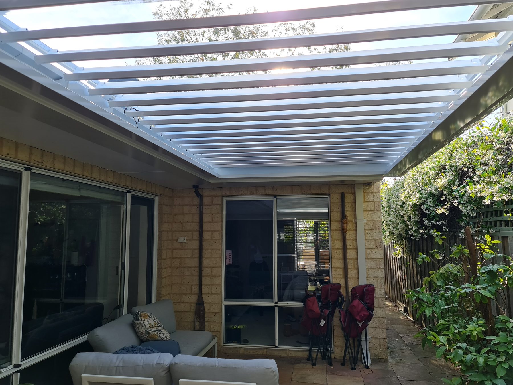 Outdoor lounge under a Stratco Outback Sunroof in Perth