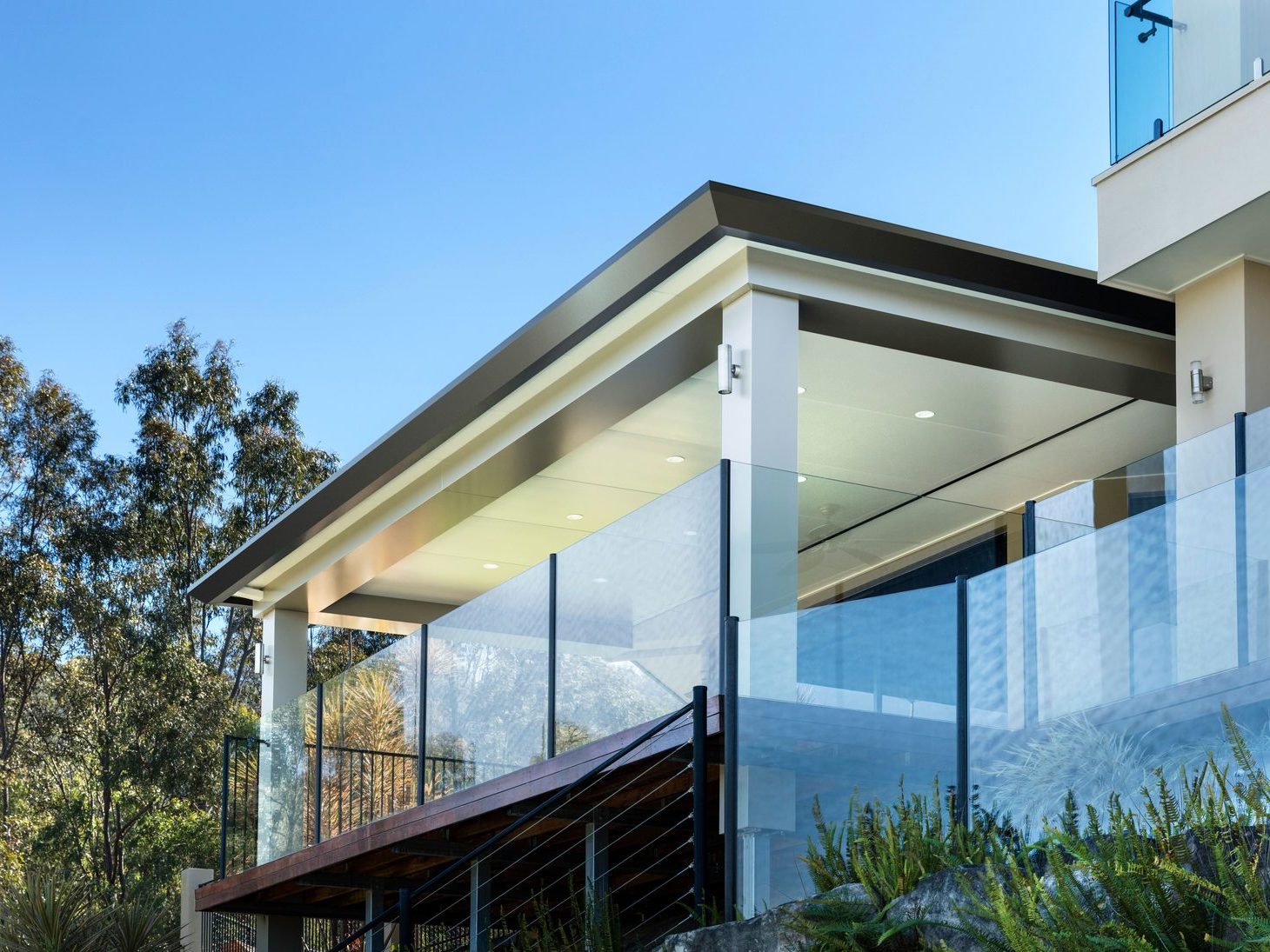 Stratco Pavilion Allure over a deck with glass balustrade